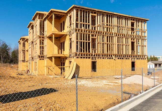 a snapshot of temporary chain link fences protecting a large construction project from unauthorized access in Coker, AL